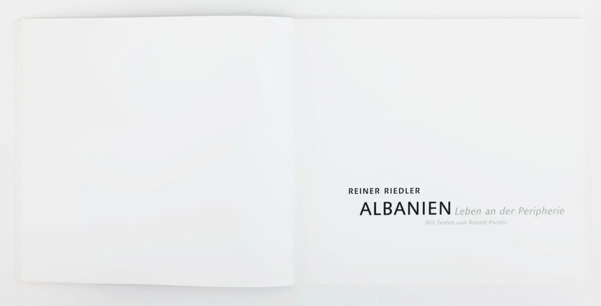 Open book, right page shows title page: REINER RIEDLER — ALBANIEN Leben an der Peripherie.