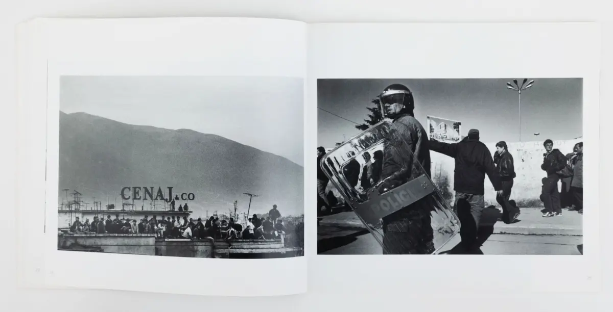 Crowd on a platform before mountains (left); helmeted riot police with shield facing protesters (right).