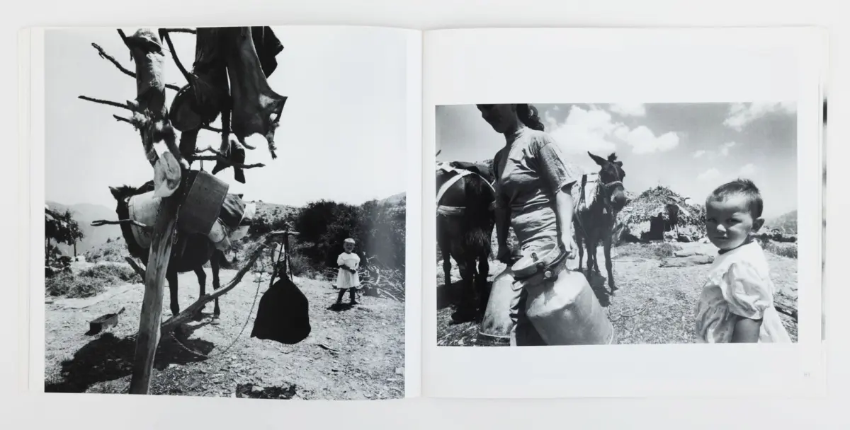 Two-page black-and-white spread: left shows a wooden post with clothes and a small child; right shows a woman with a child beside horses near huts.