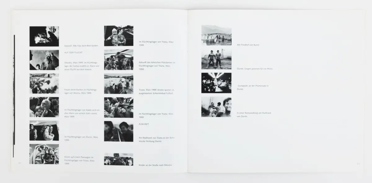 Open photo-book spread showing a grid of black-and-white documentary photos with German captions about refugees in Albania.