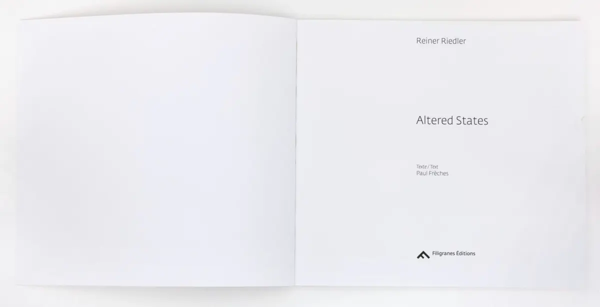 Open book spread displaying title page: Altered States by Reiner Riedler; Texte/Text Paul Frèches; Filigranes Editions logo.