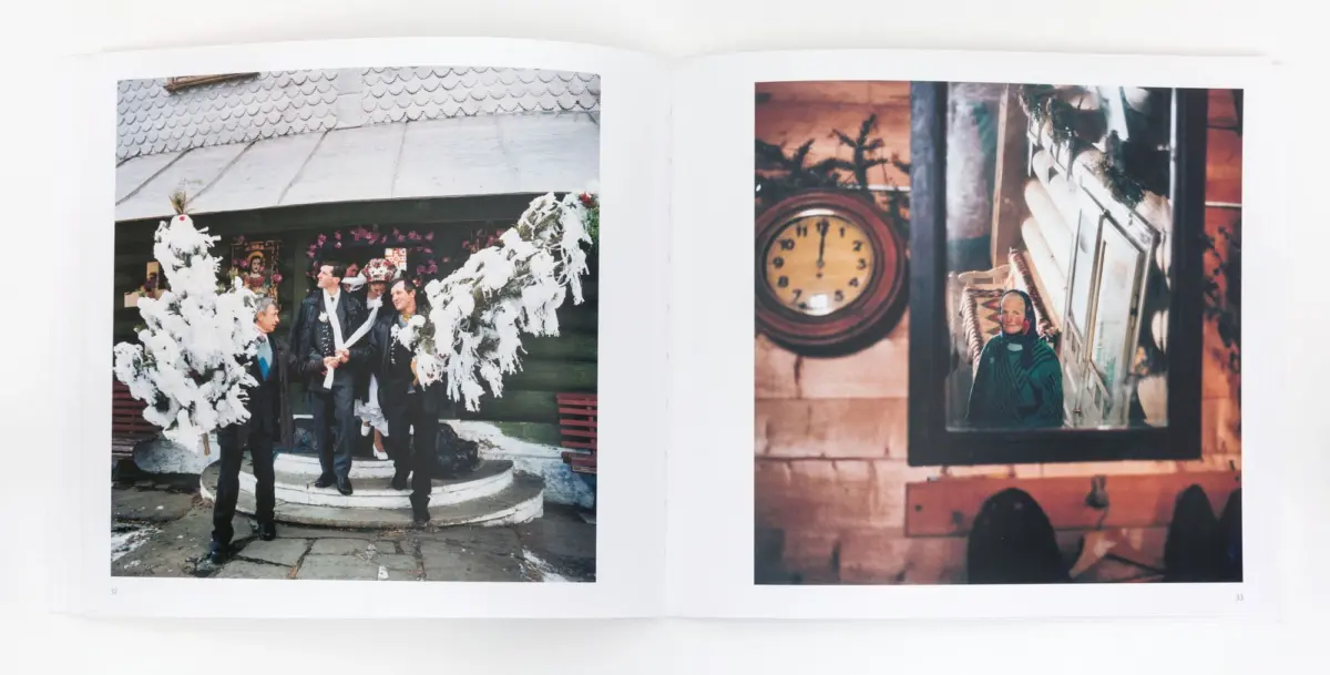 Group of men in suits stand outside near a large white floral arch; right page shows an elderly person in a green striped shawl beside a wall clock.