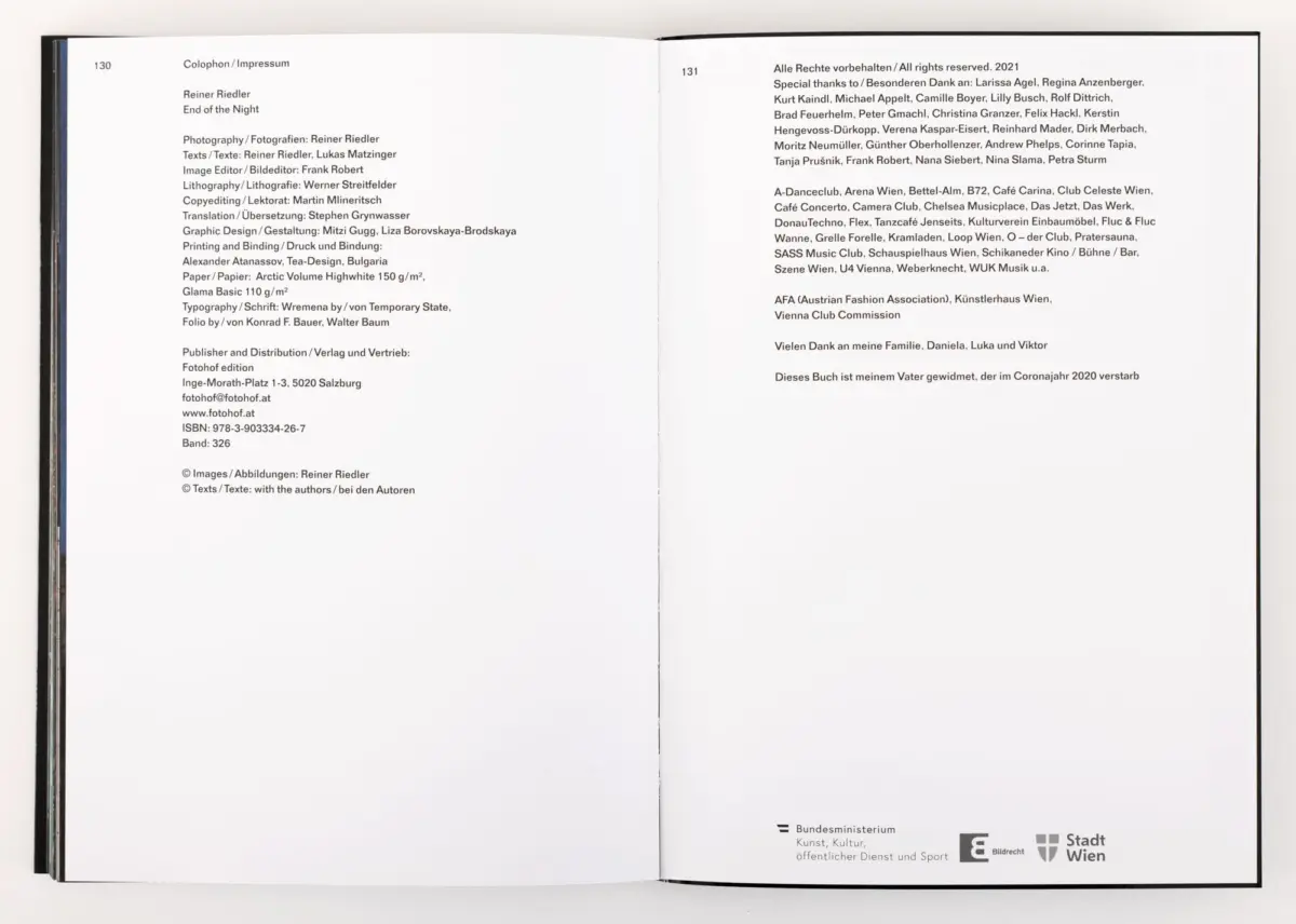 Open book spread displaying Colophon/Impressum on left and acknowledgments on right, binding visible on white surface.