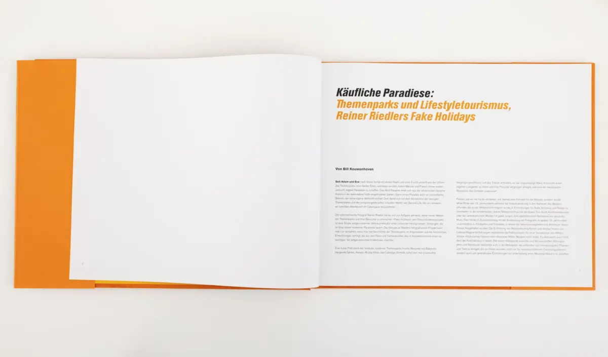 Open book on a white surface with an orange cover; right page shows bold German title 'Käufliche Paradiese' in black and orange.