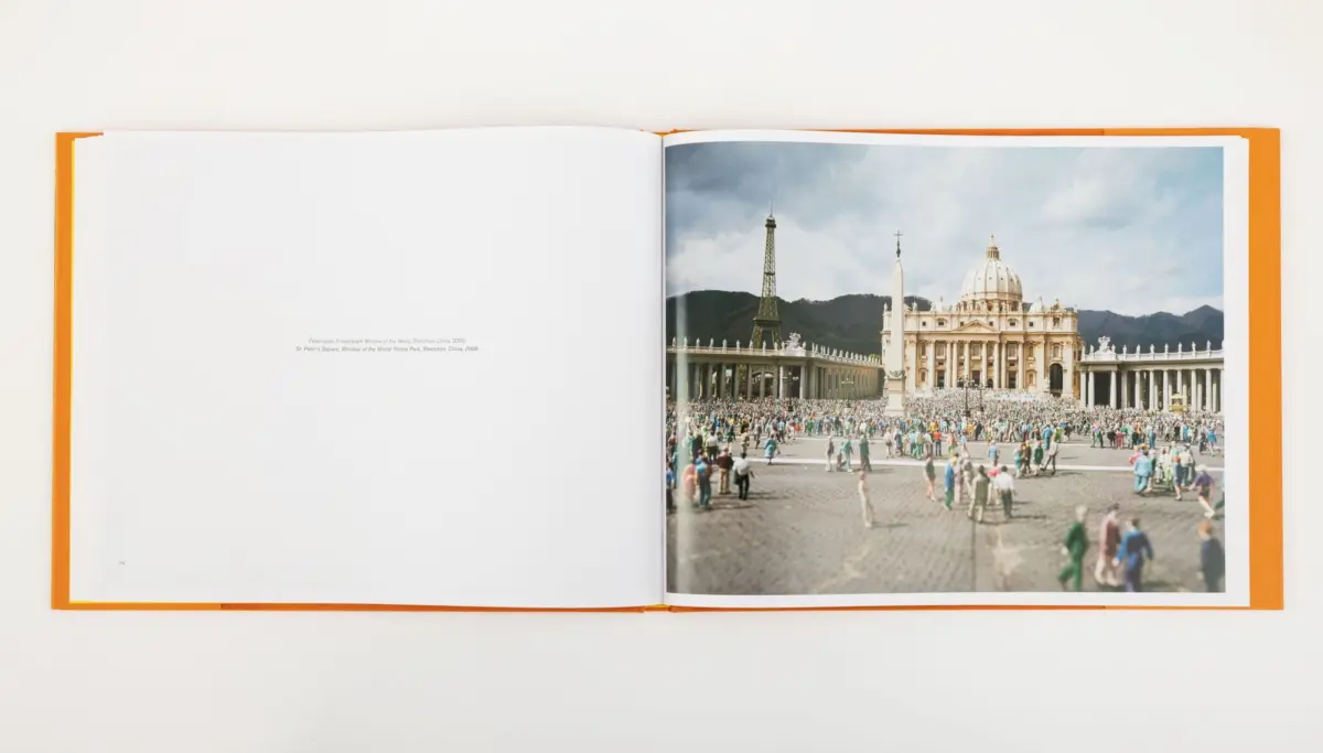 Open book with orange cover; photo of St. Peter's Square showing the obelisk, St. Peter's Basilica, and a large crowd.