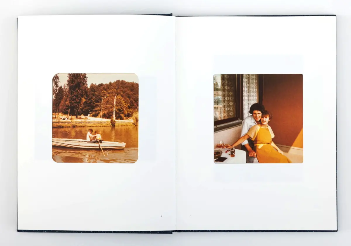 Open photo album displaying two vintage images: left shows two people in a boat on a lake with trees; right shows two people posing indoors by a window.