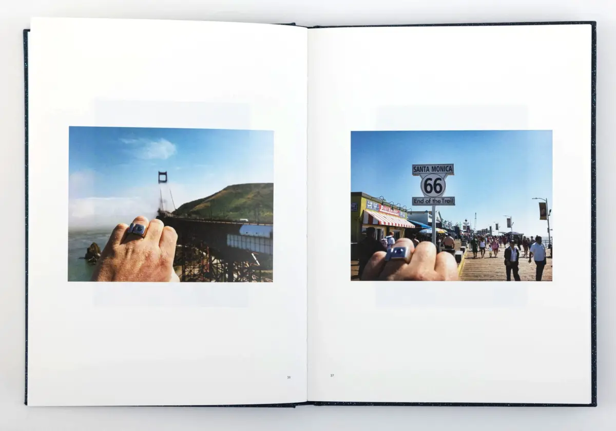 Open book shows two photos: left hand holds a photo of the Golden Gate Bridge; right Santa Monica Pier with Route 66 End of the Trail sign.