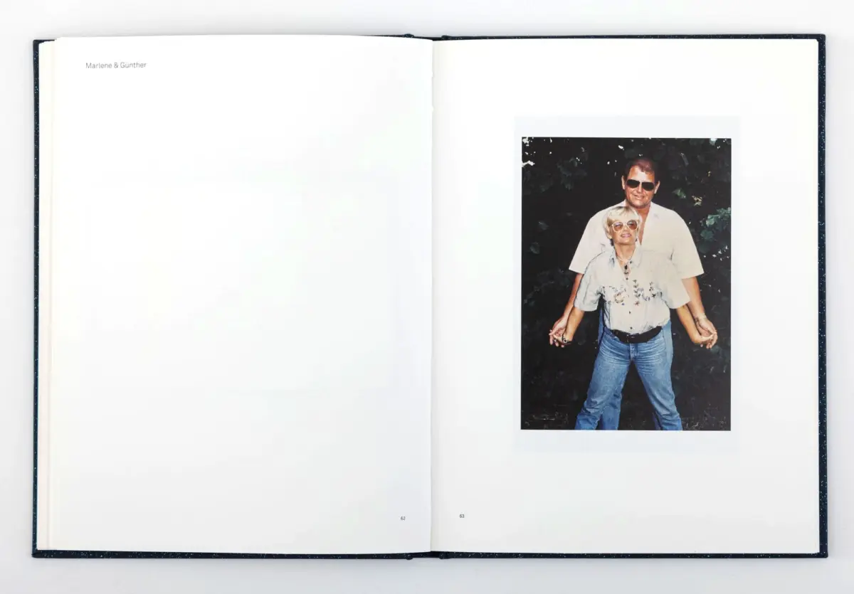 Open book spread featuring a photo of a man and woman wearing sunglasses, posing outdoors with greenery.