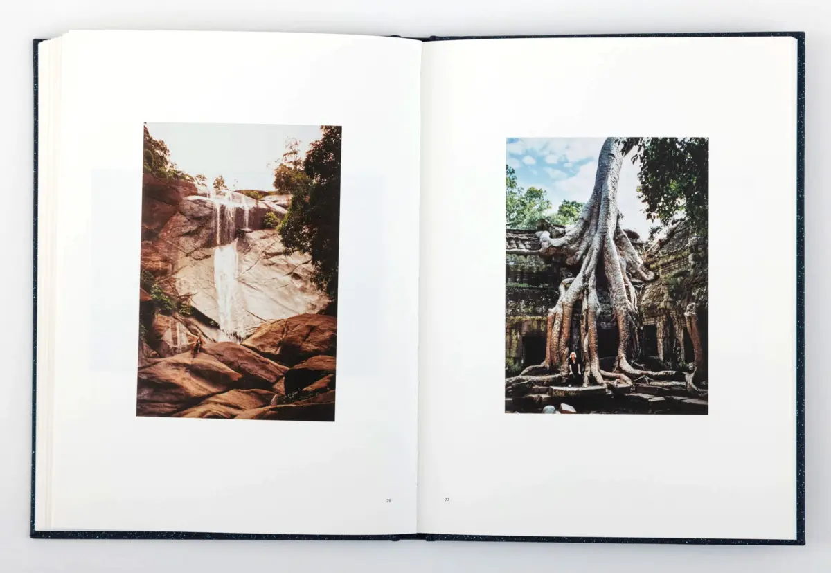Open book displaying two photos: left shows a waterfall on rocky cliffs; right shows a large tree with exposed roots over ancient ruins.
