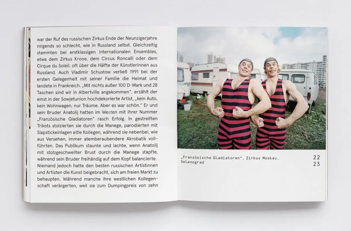 Open book spread; right page shows two muscular people in red-and-black striped swimsuits flexing outdoors, with vans in the background.