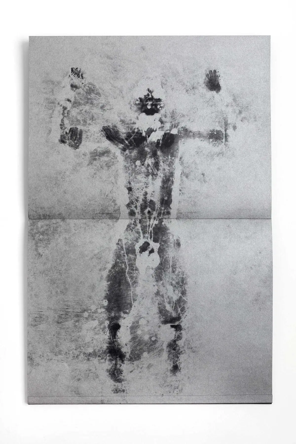 Silhouette of a person with arms raised, set against a textured grayscale two-panel background.