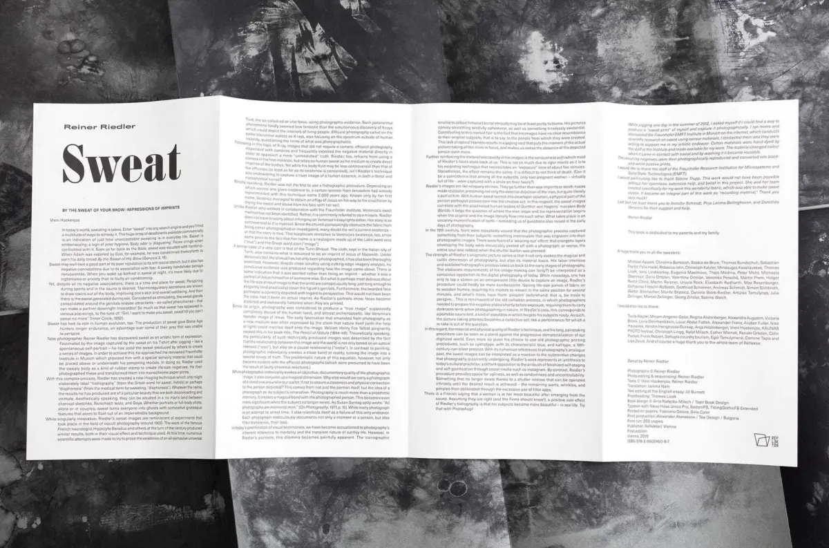 Open pamphlet laid on a dark textured surface; left page features a large 'Sweat' title.