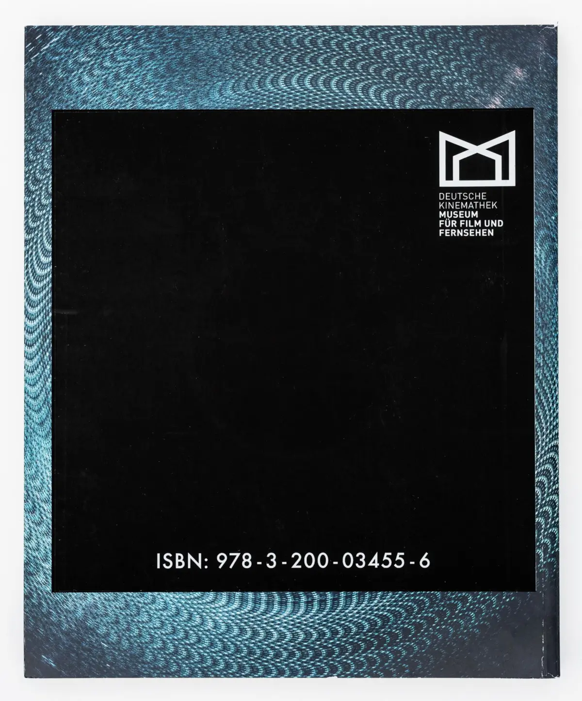 Back cover with blue speckled border and black central panel; Deutsche Kinemathek logo and ISBN 978-3-200-03455-6.