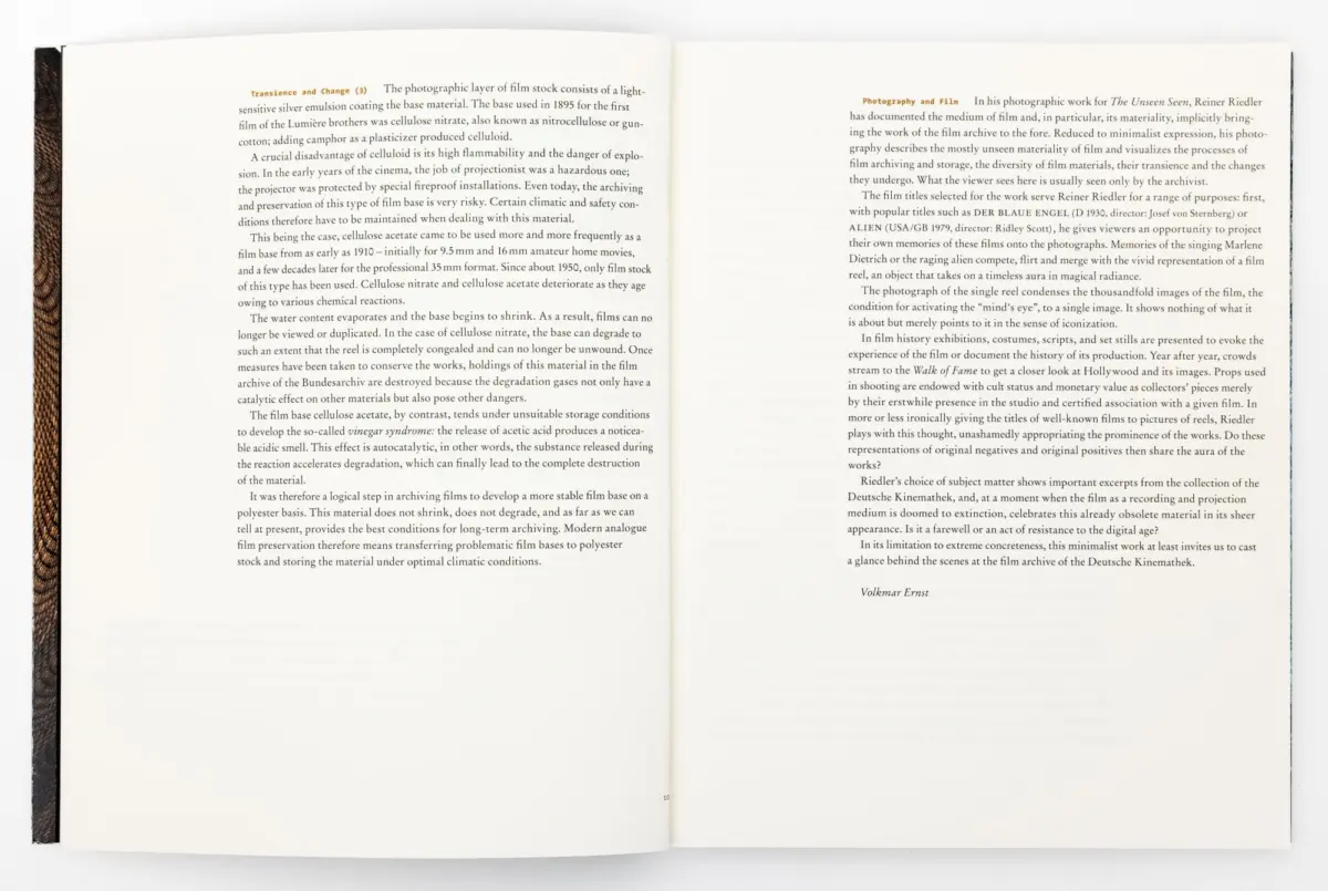 Open book photographed from above; two pages of dense text with headings 'Transience and Change' (left) and 'Photography and Film' (right).