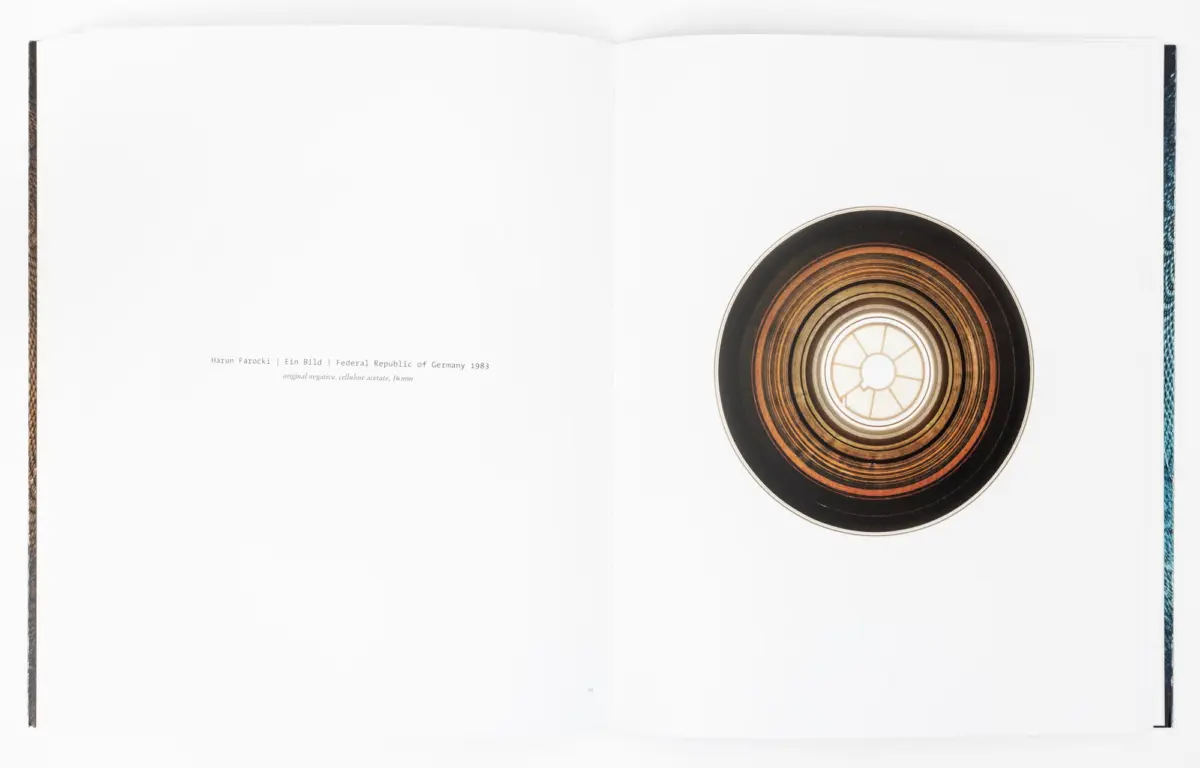 Open book spread with a circular disk of concentric rings on the right page.