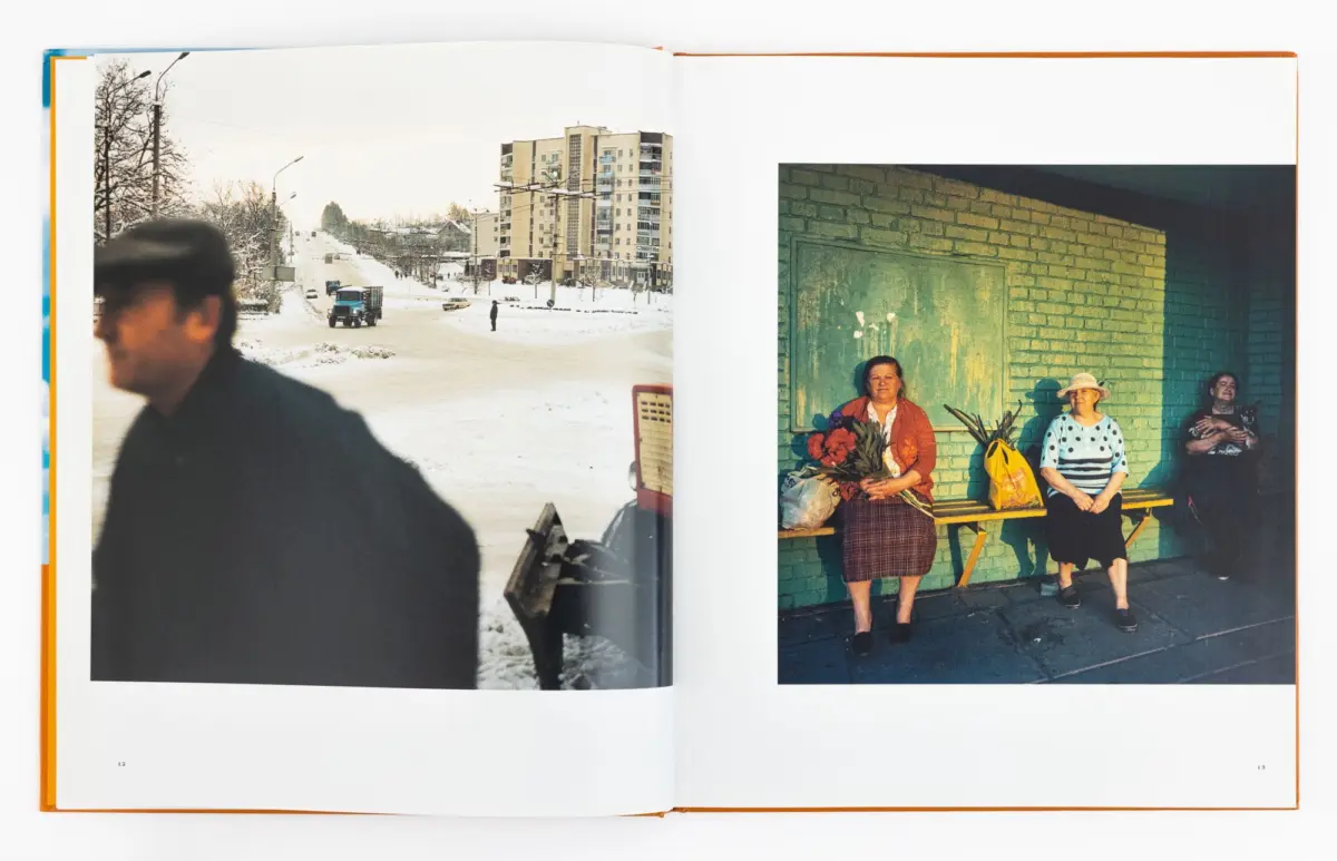Left: snowy city street with blurred passerby, truck, and tall apartment building. Right: three people by a brick wall; one holds flowers.