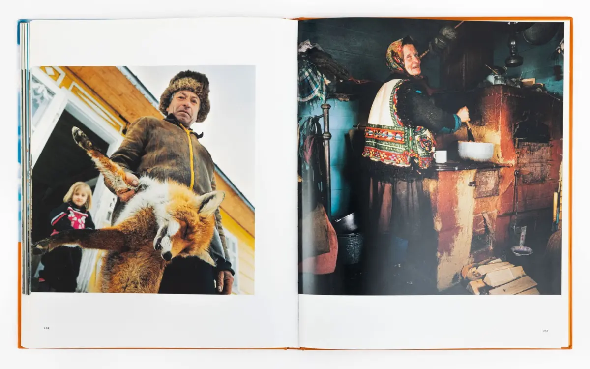 Adult in a fur hat holds a fox outdoors beside a house; a second scene shows an older woman in traditional dress cooking at a rustic stove.