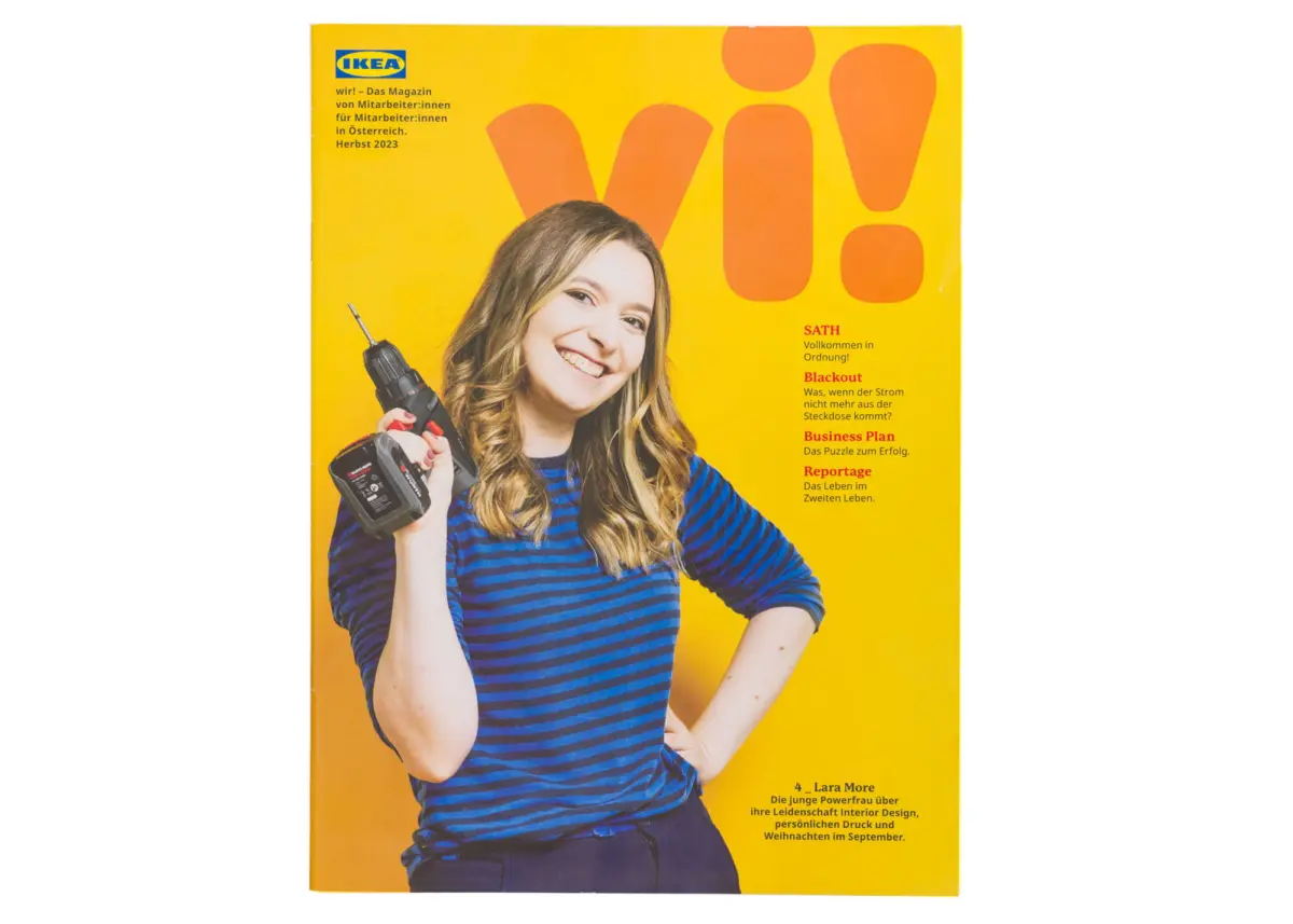Person smiling while holding a cordless drill, wearing a blue striped shirt, on a bright yellow IKEA magazine cover.