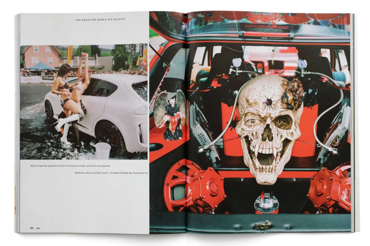 Two bikini-clad people by a white sports car in water at an outdoor car event; right page shows a red-car interior with a large skull prop.