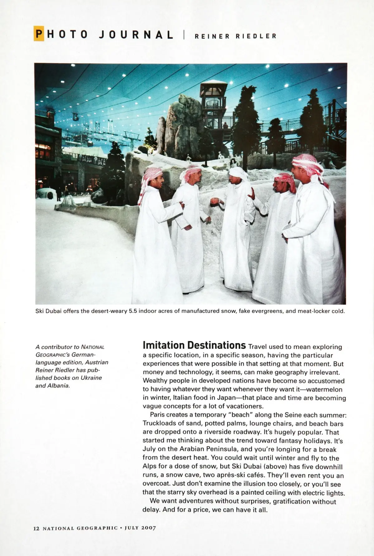 Group of Arab men in white thobes and red checkered keffiyehs converse in an indoor snow park with rock formations at Ski Dubai