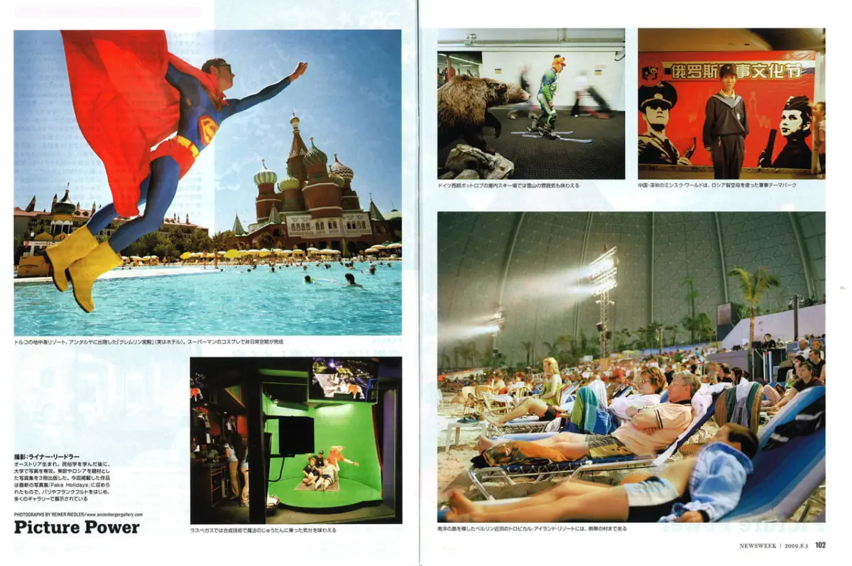 Superhero in blue suit with red cape leaps over a resort pool, Saint Basil's Cathedral in Moscow in the background.
Television studio with green screen and crew filming a scene.
Indoor skier in green gear glides past a large brown bear statue.
Young man in gray outfit stands beside a red poster with two portraits.
People lounging on beach chairs in an indoor stadium under a glass roof with palm trees.