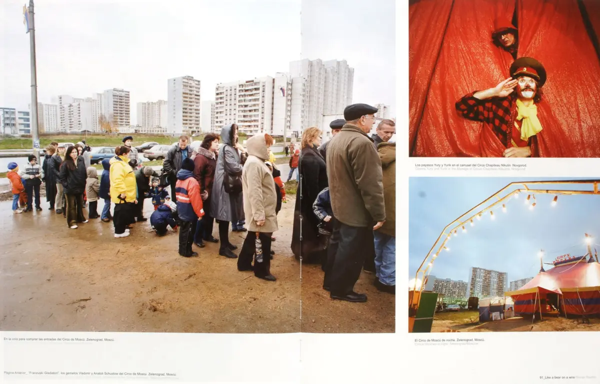 Crowd lines up outdoors beside tall apartment blocks; right panel shows a red-curtained clown wearing a hat and yellow scarf.