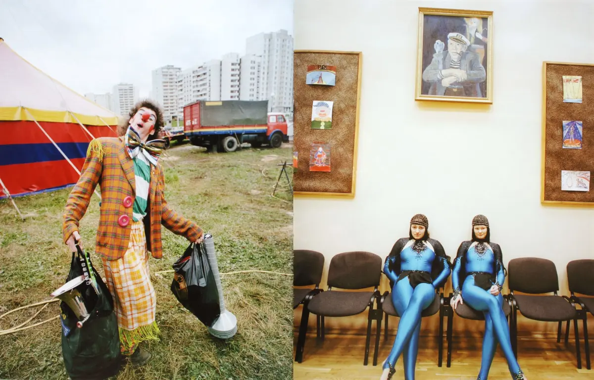 Clown in a plaid suit with red nose and oversized bow tie carries bags outdoors beside a striped tent; interior shows framed art and two performers in blue bodysuits.