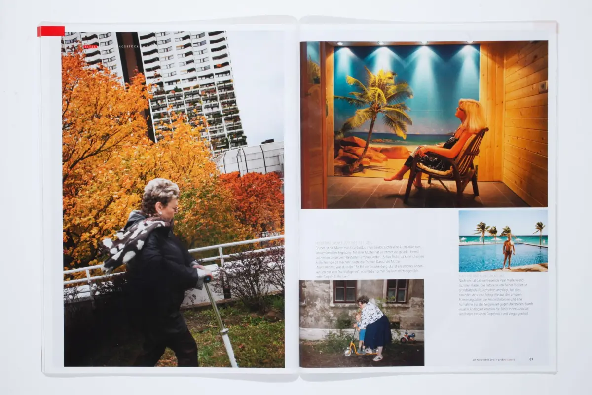 Elderly woman walking with a cane near orange autumn trees beside a high-rise; on the right, a woman sits indoors before a tropical beach mural.