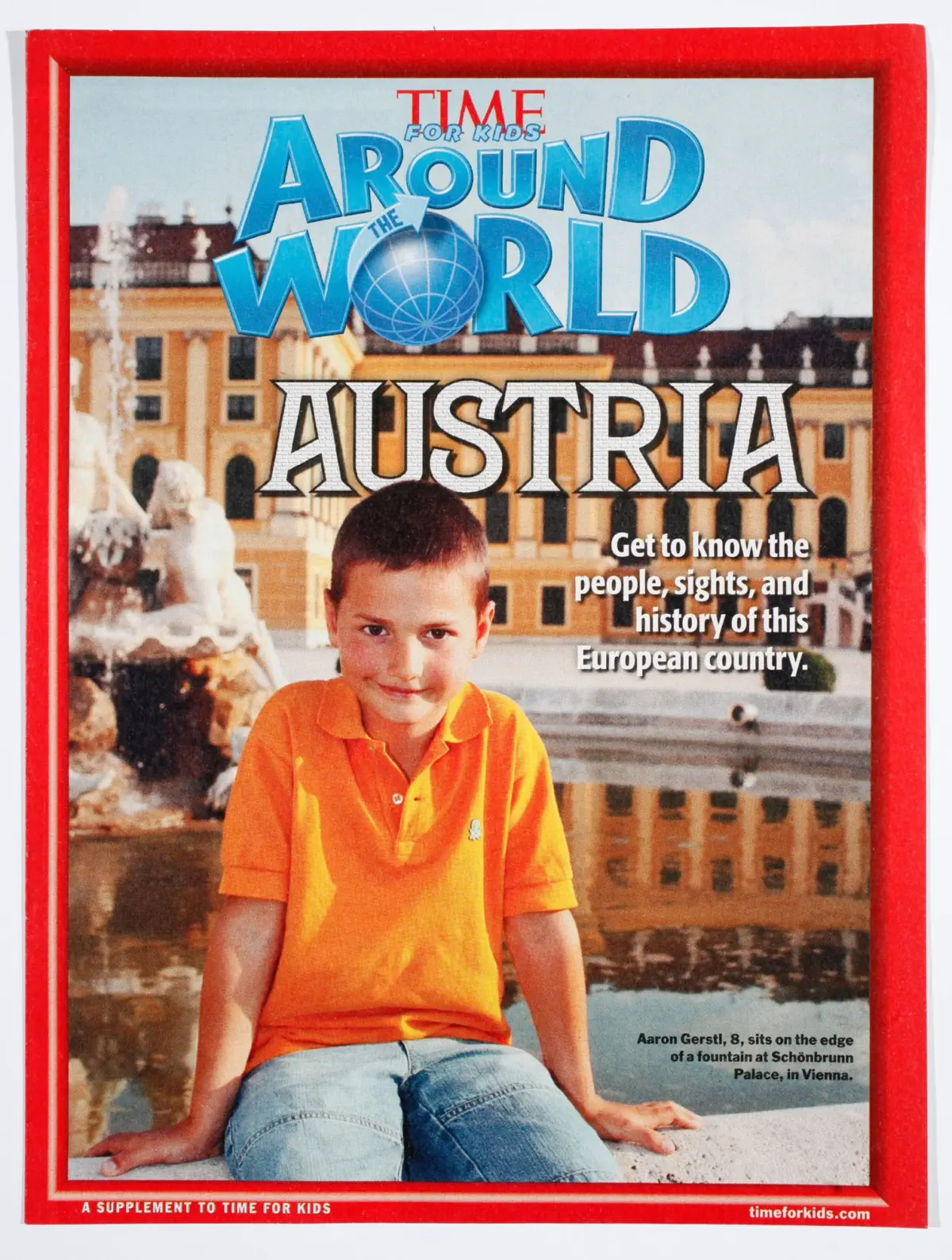 An eight-year-old boy in an orange polo sits on the edge of a fountain in front of Schönbrunn Palace, Vienna, Austria.
