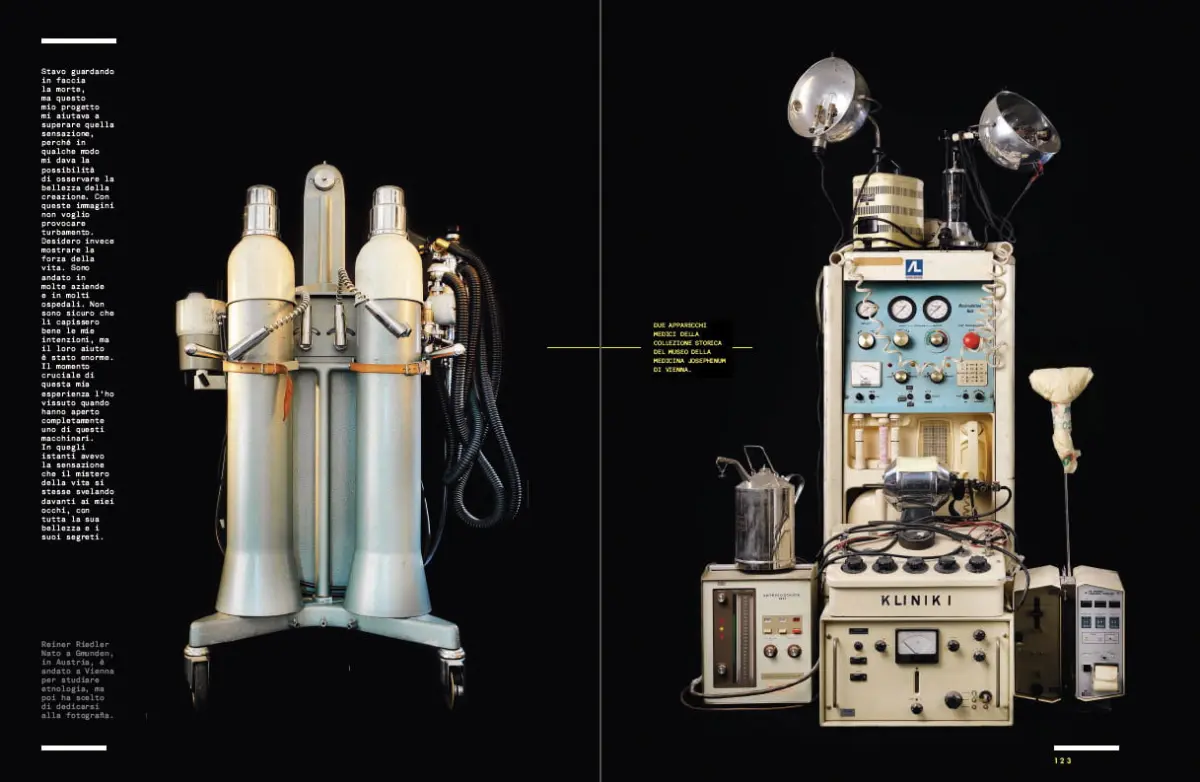 Pair of tall medical gas cylinders with hoses on left; vintage anesthesia machine with gauges, dials, and lamps on right against black backdrop.