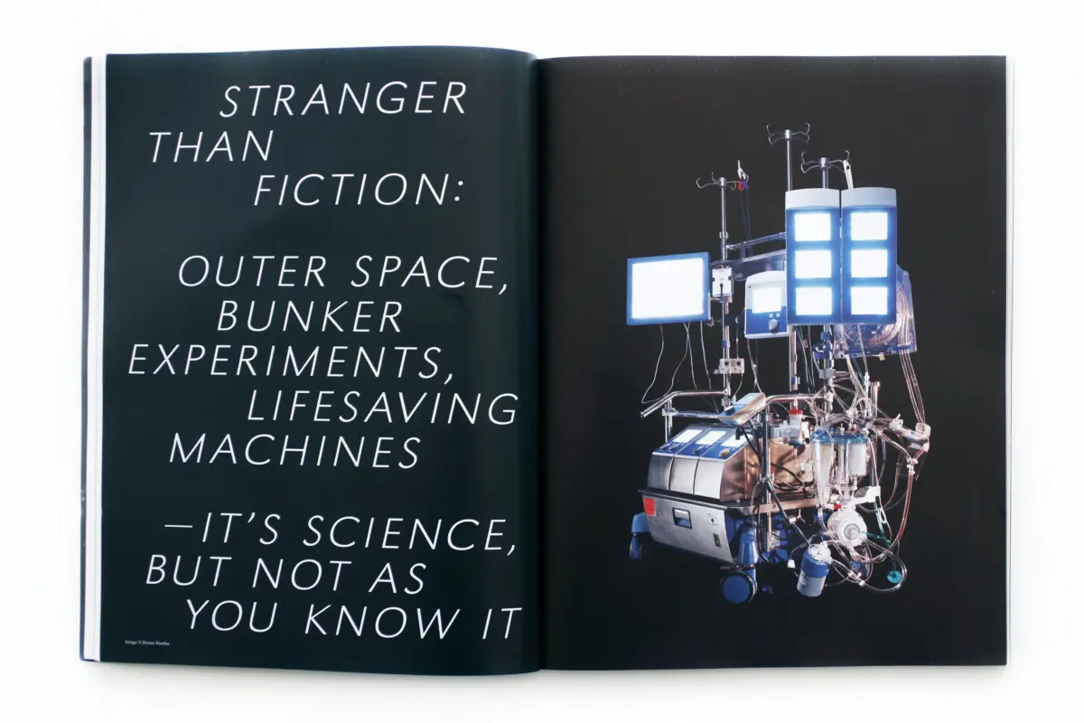 Open book spread with bold science text on the left and a complex laboratory apparatus on the right.