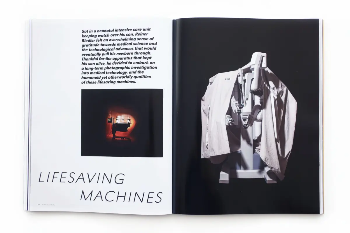 Open magazine spread; left page with bold text and 'LIFESAVING MACHINES'; right page shows a draped Da Vinci surgical robot.