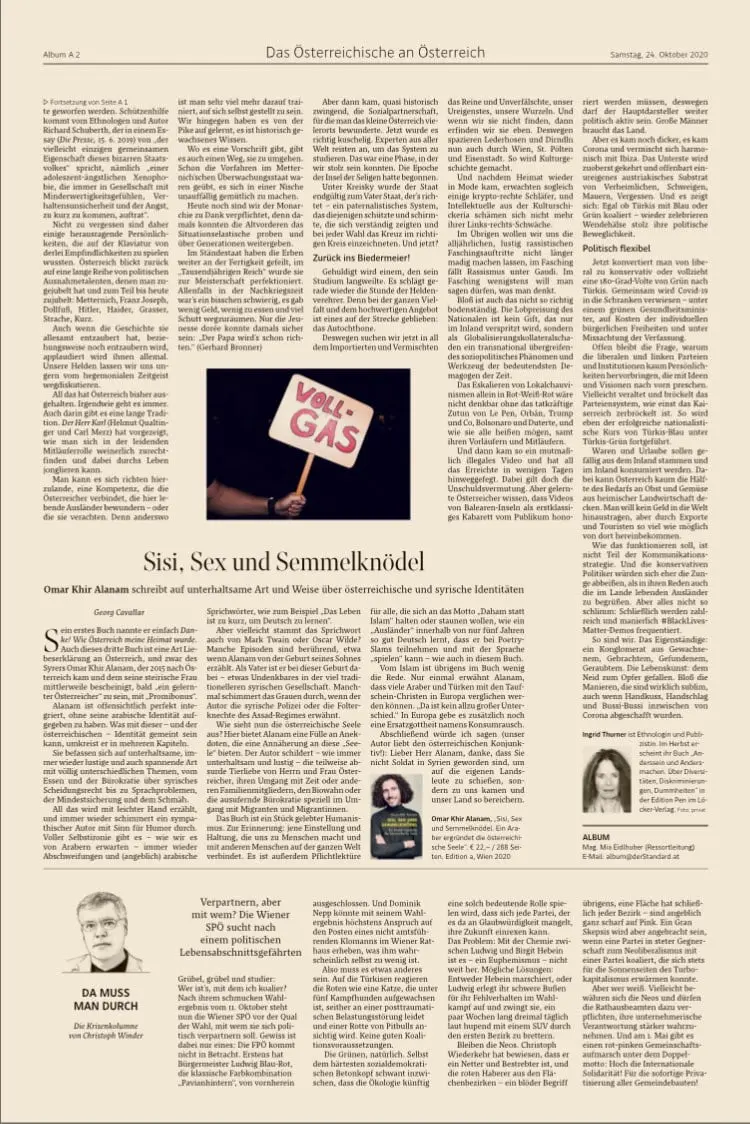 Newspaper page featuring a central photo of a hand holding a VOLL-GAS sign