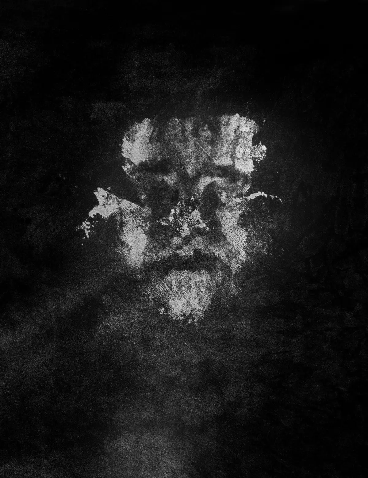 White chalk smear on a dark textured surface.