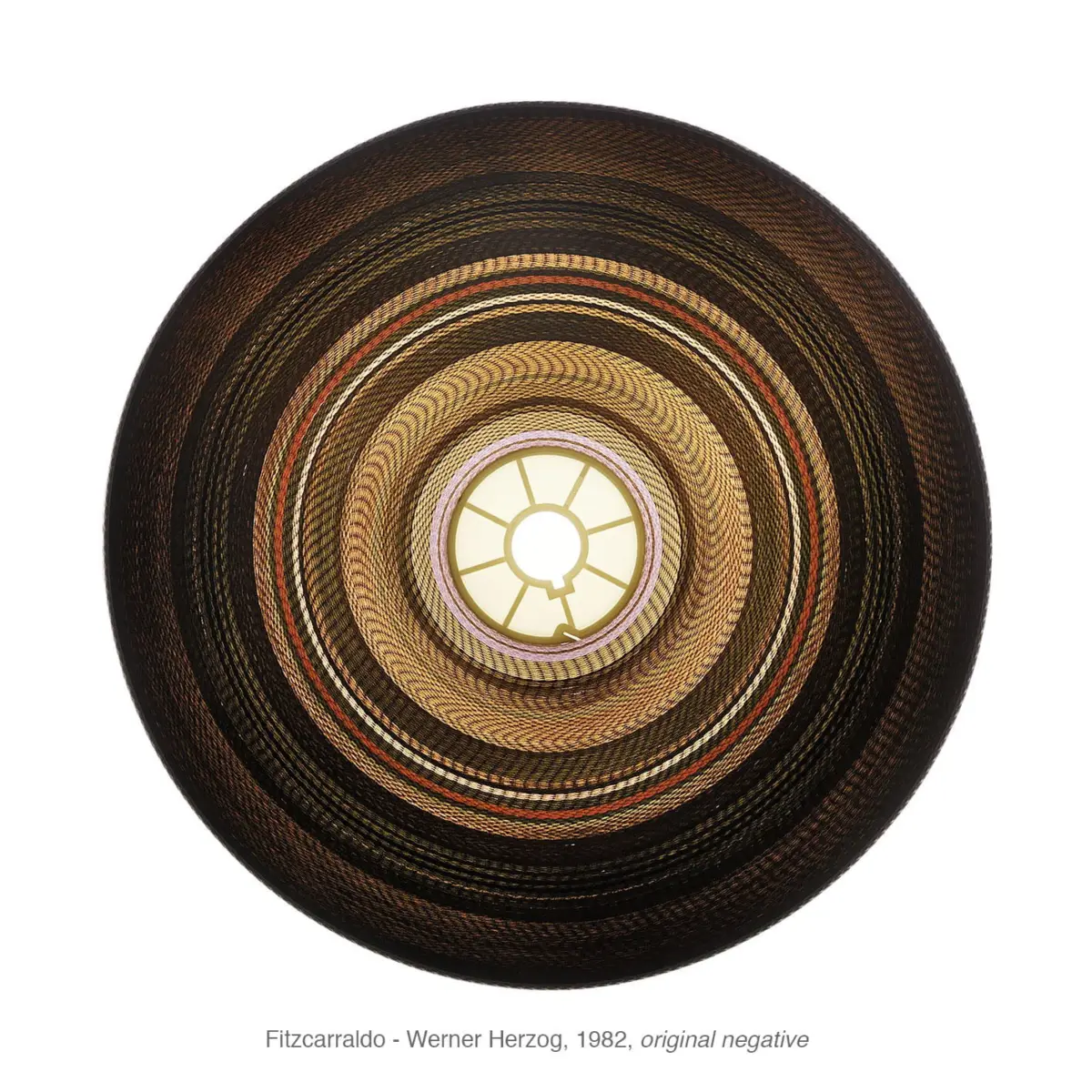 Top-down view of a circular woven straw hat with concentric rings on a white background.