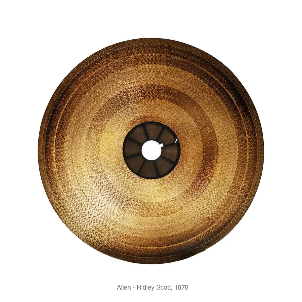 Top-down view of a golden woven rattan lampshade with a central black socket against a white background.