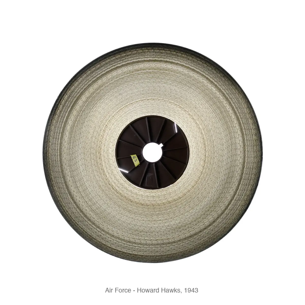 Top-down view of a circular woven straw disc with a dark central hub and radial spokes.