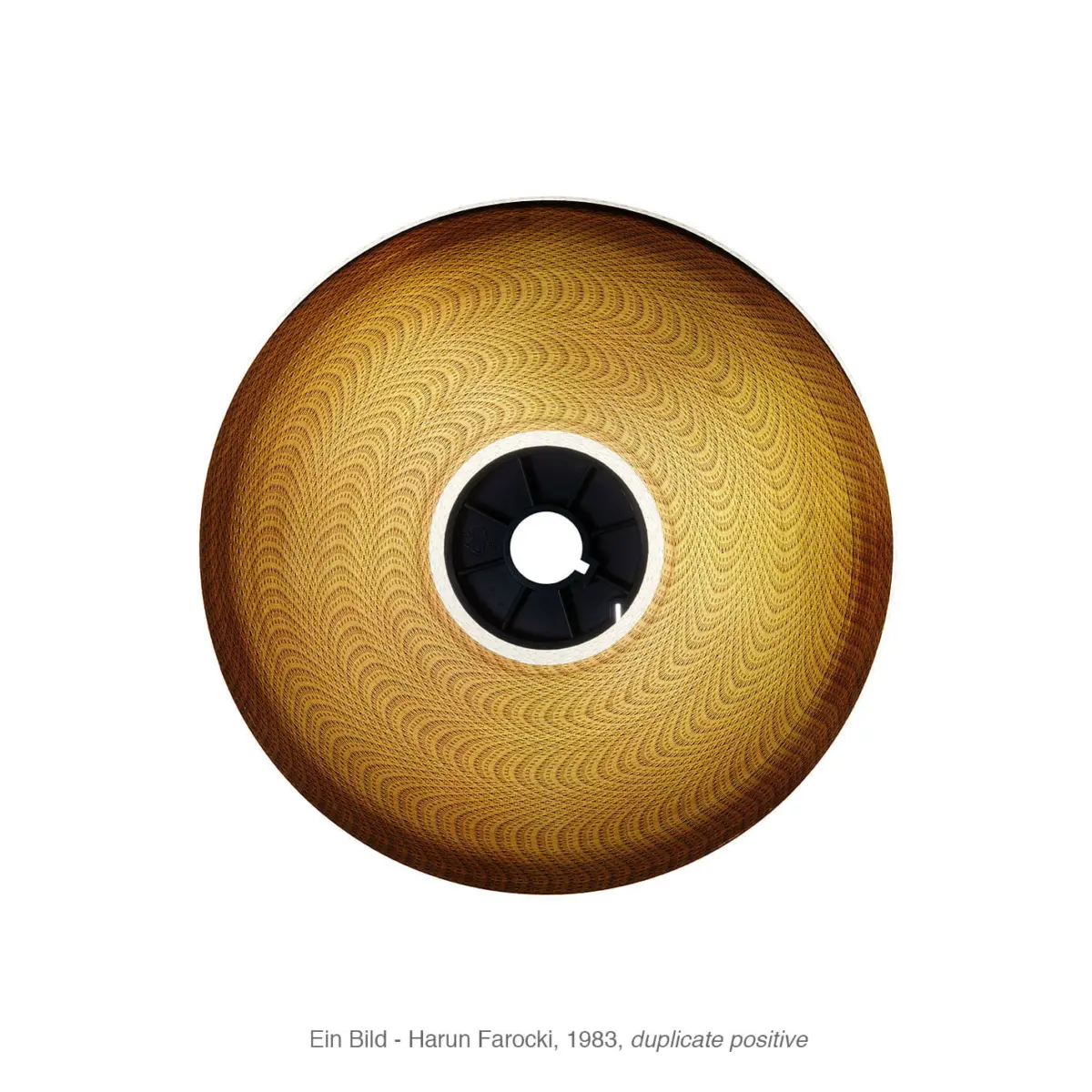 Gold-toned circular disc with an intricate spiral pattern and black central hub against a white background.