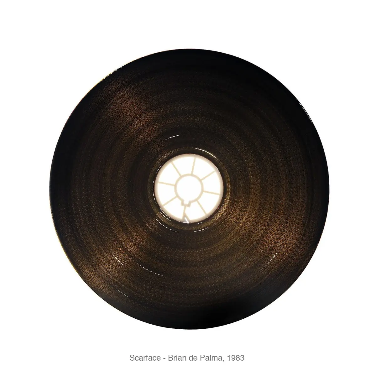 Top-down view of a circular black woven lampshade with a bright central light against a white background.