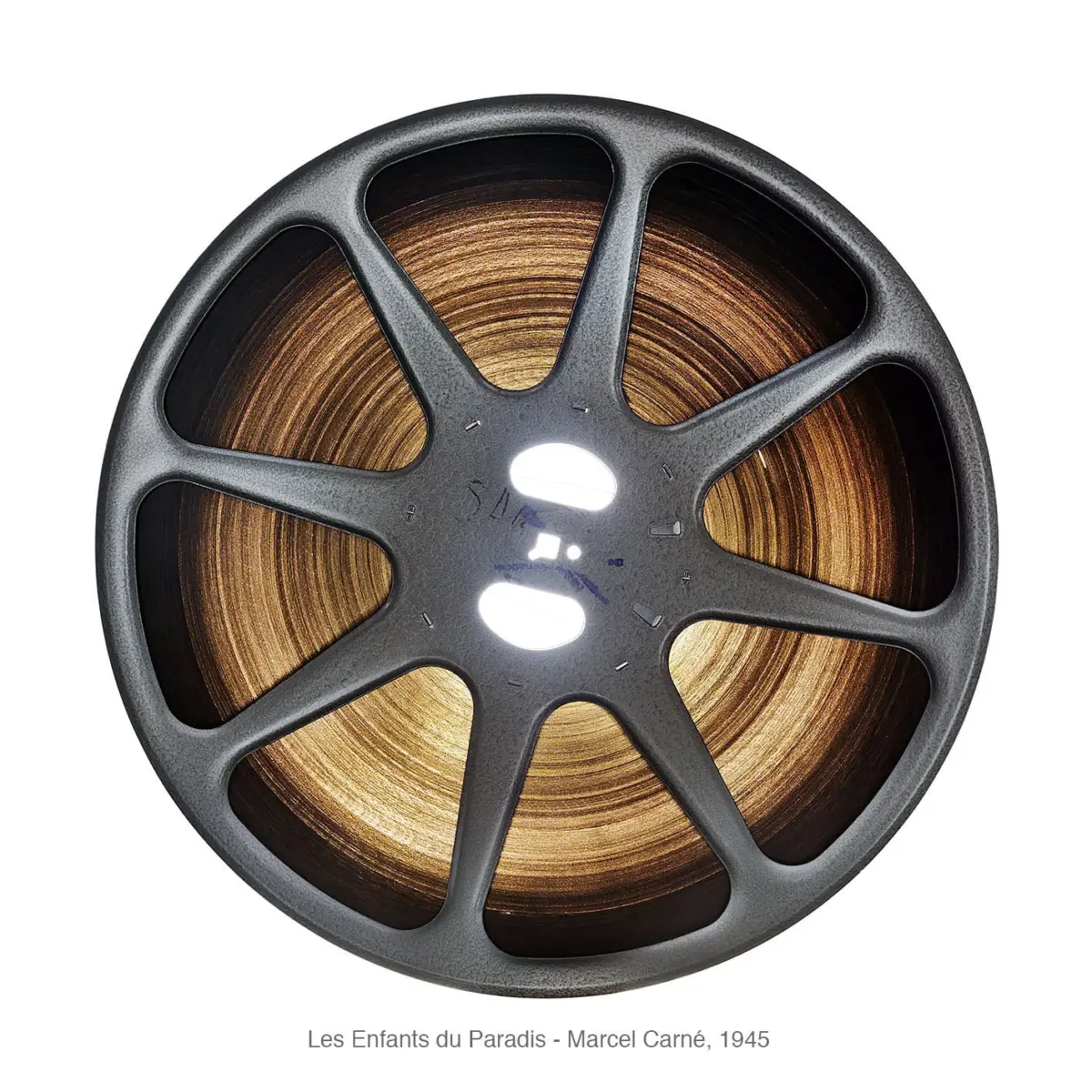 Gray metal film reel with brown wound film on white background.