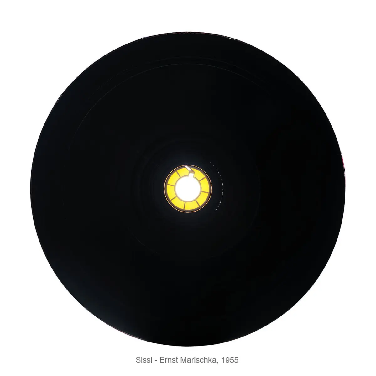 Interior view of a black circular lampshade with a glowing yellow center.