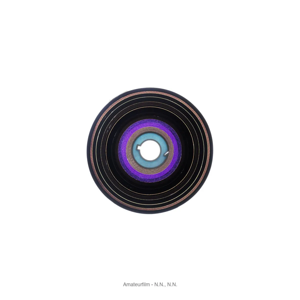 Close-up of a circular, multi-layered disc with concentric purple, blue, and black rings and a central hole on a white background.