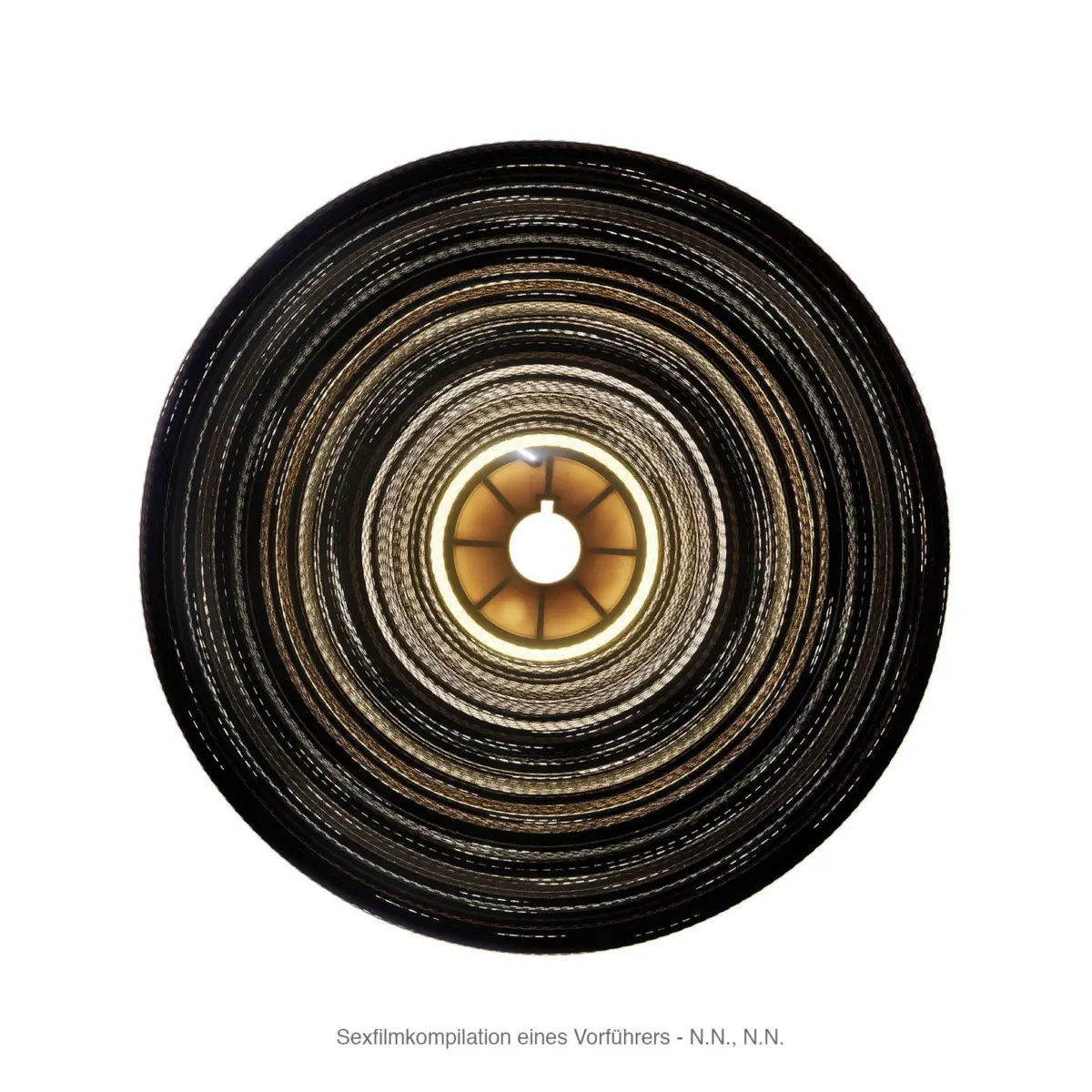 Close-up of a circular metallic coil with a glowing inner hub.