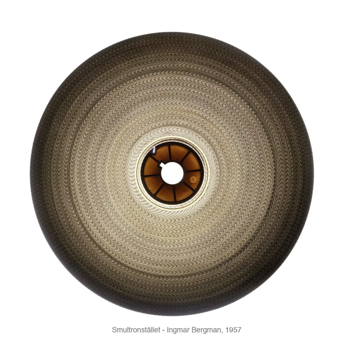 Circular woven sculpture with concentric rings and a central hole on a white background.