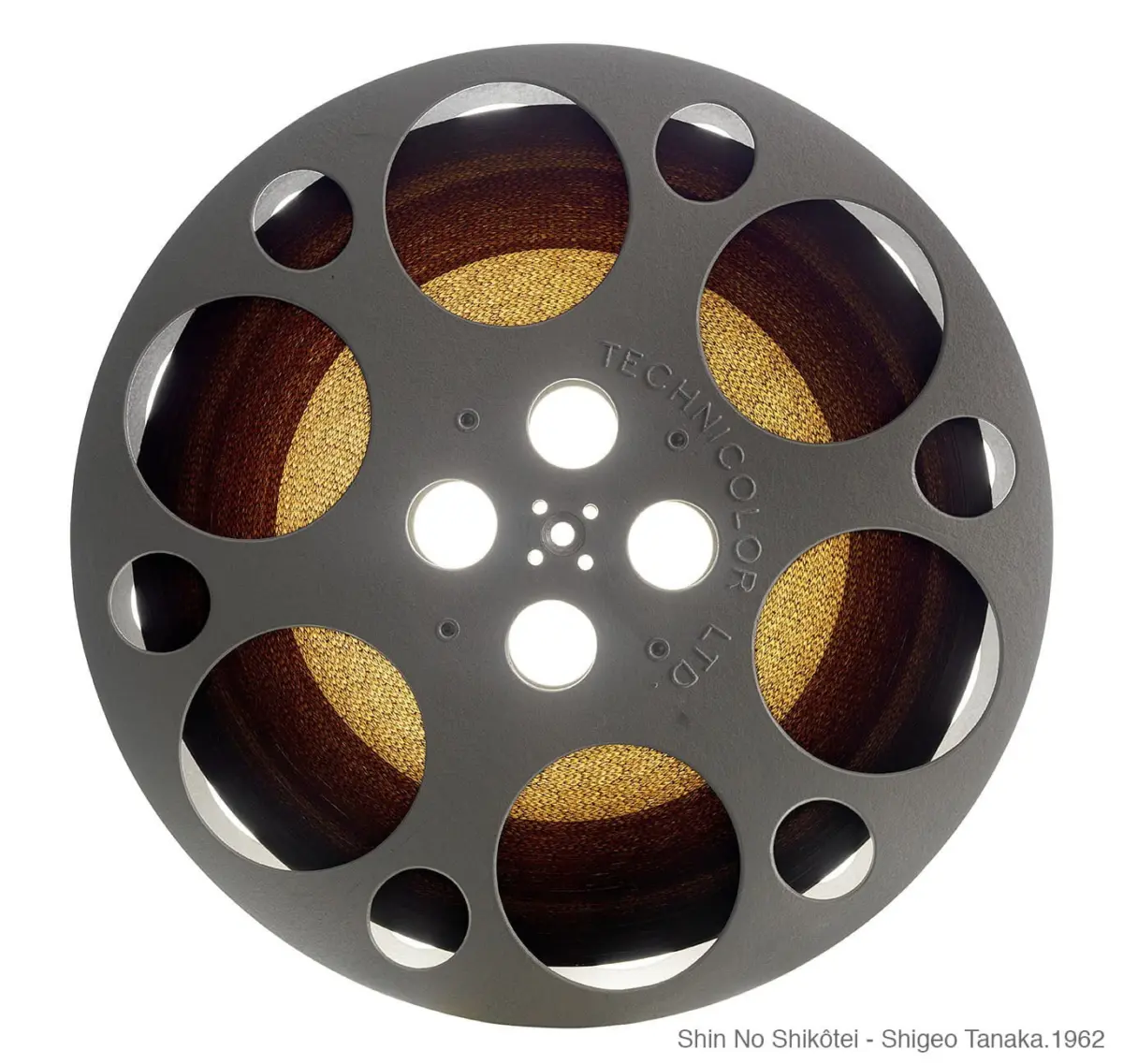 Front view of a grey circular film reel with amber film wound inside, on a white background.