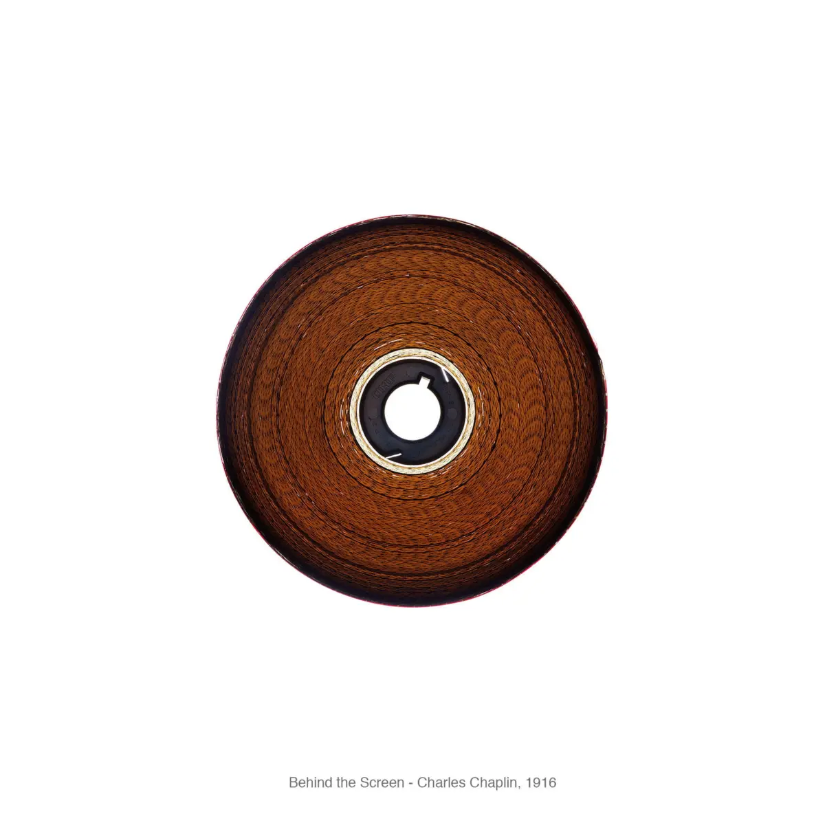 Top-down view of a round wooden disk with concentric grain and a central metal hub.