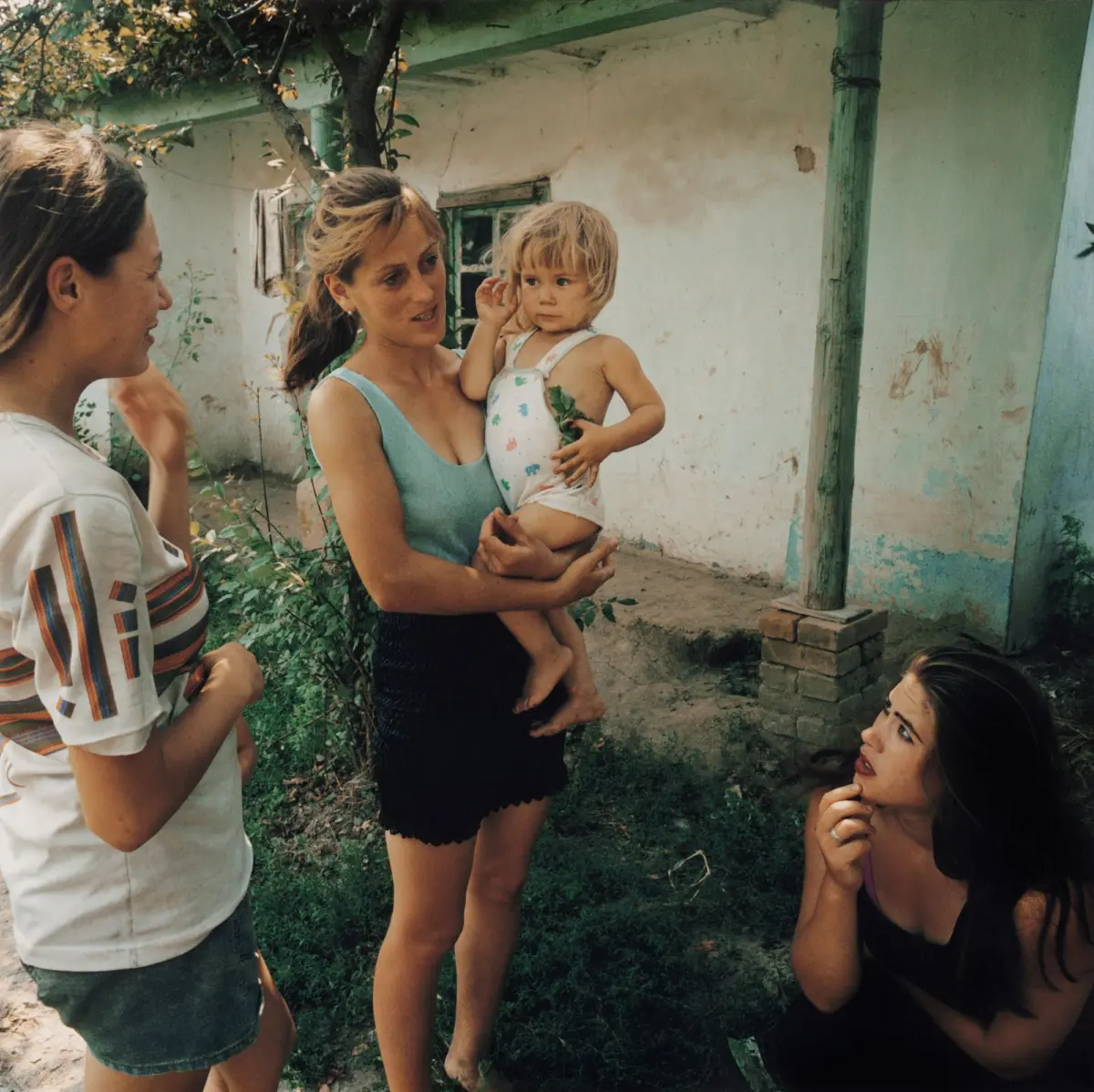 Woman with child and friendly neighbours in Izmail