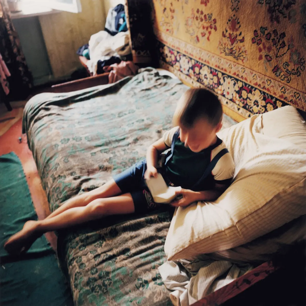 Boy reading in the living room in Izmail