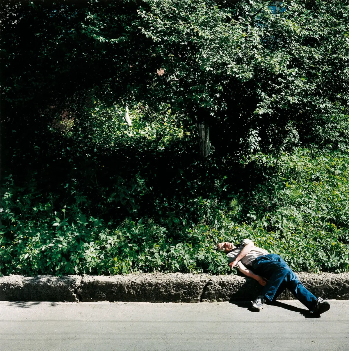 Drunk man on the roadside in Chernivtsi