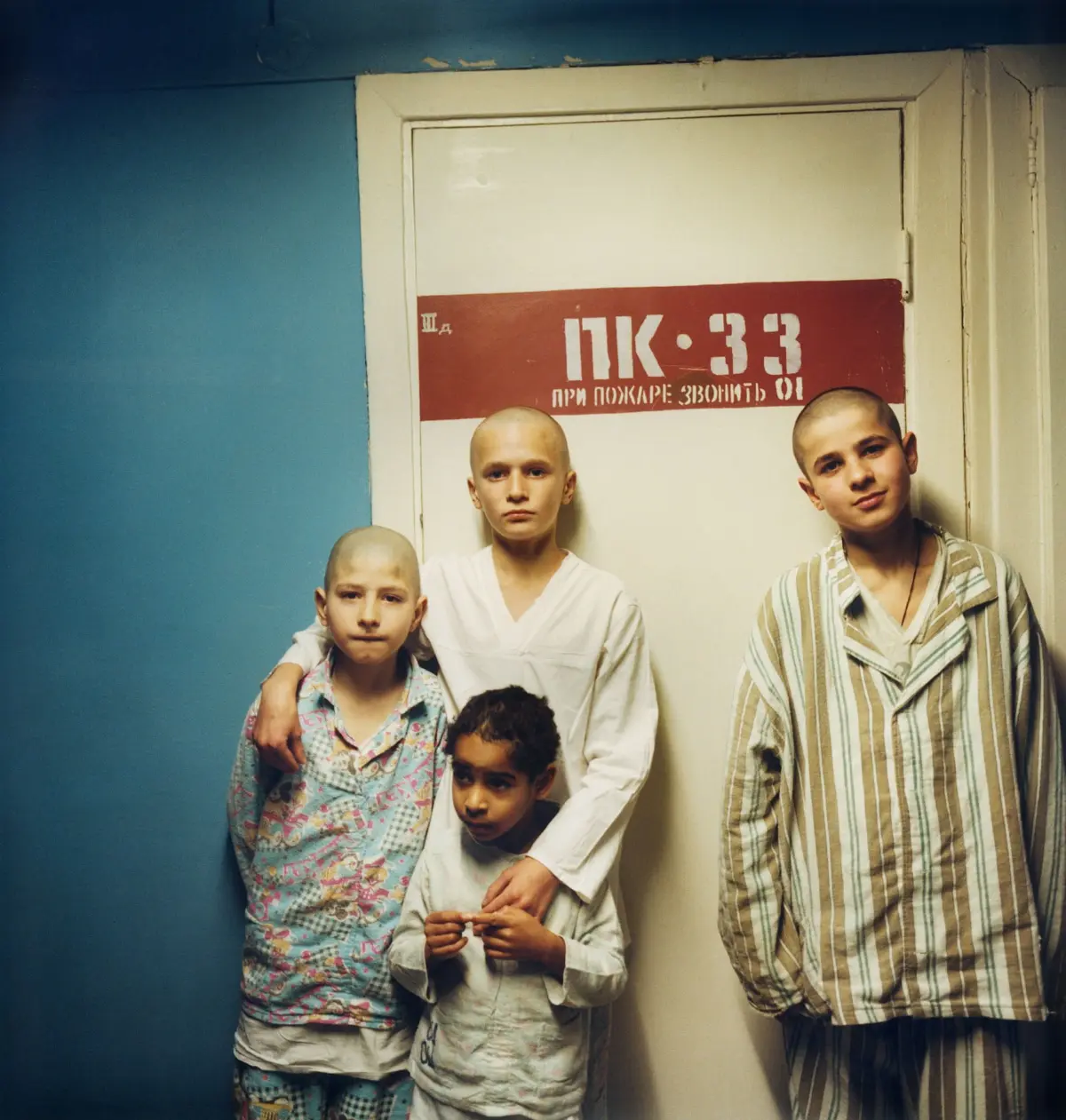 Street child Ilia (centre) with other street children in the children's ward at the hospital in Kiev.
